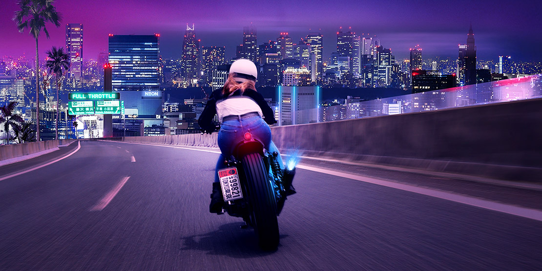 Biker runs through the Tokyo highway riding a Harley-Davidson